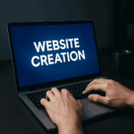 Current image: Hands typing on laptop, website creation